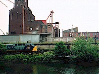 CSX SD70MAC 145 rolls south (although they probably call it east) along the Cuyahoga River in Kent, OH.